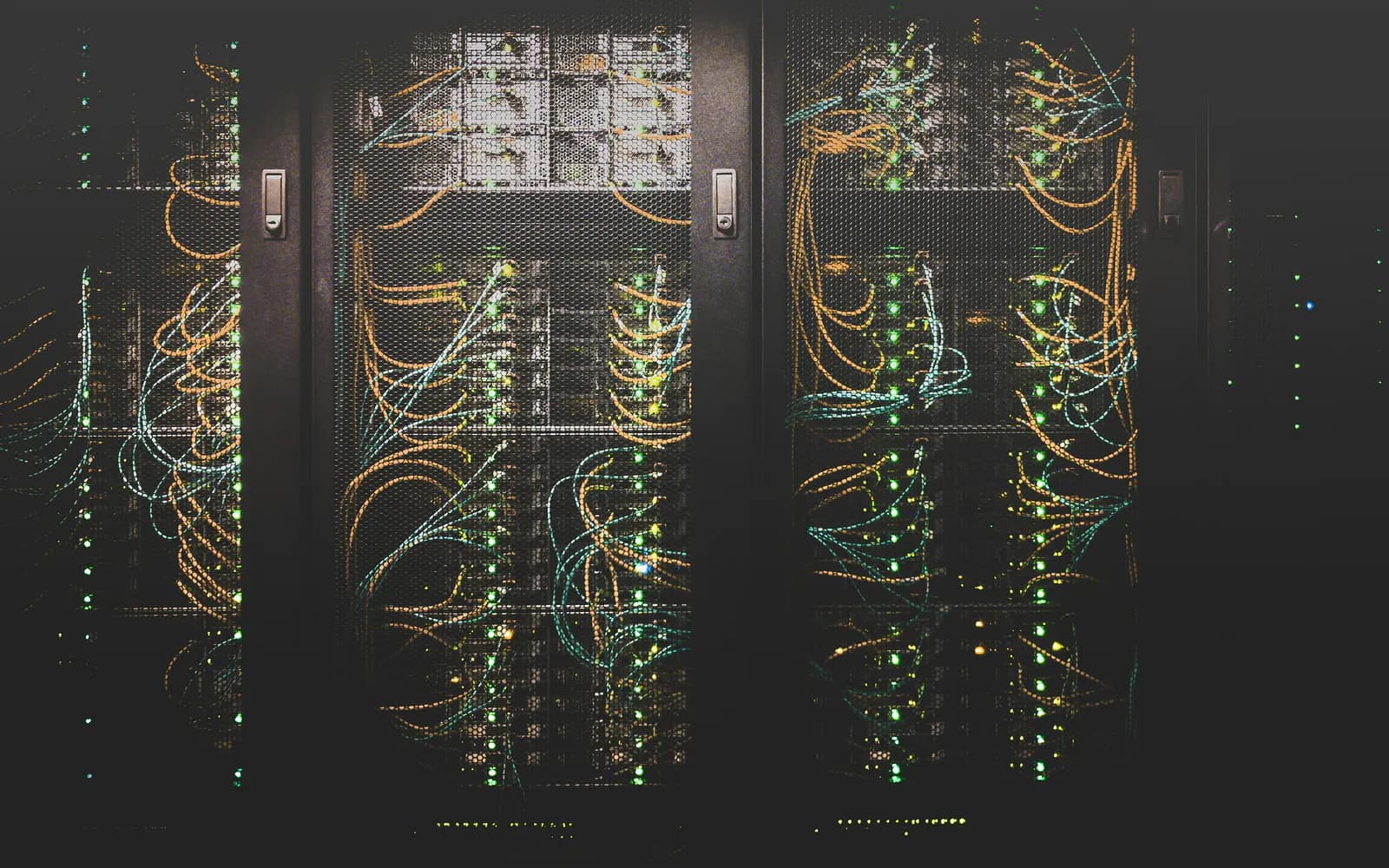 Server racks and network cabling inside a data center